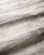 Amara viscose hand-loomed area rug in Pearl, draped to show the sheen