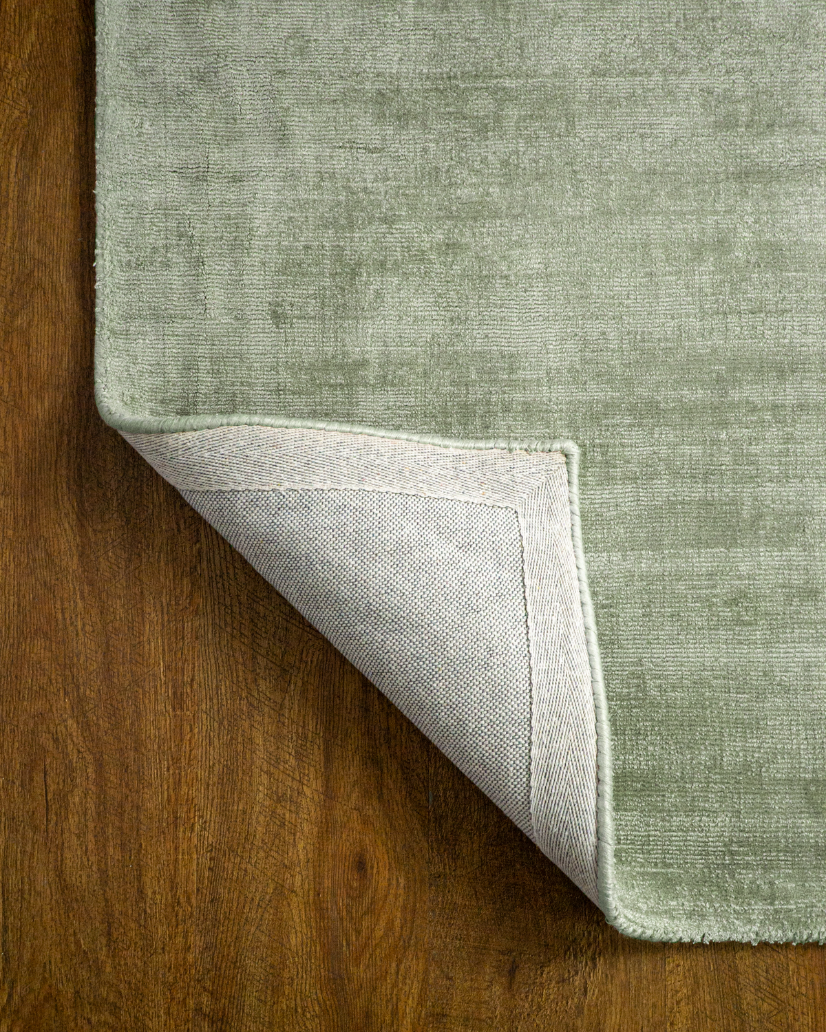 Amara viscose hand-loomed area rug in Sage, backing view