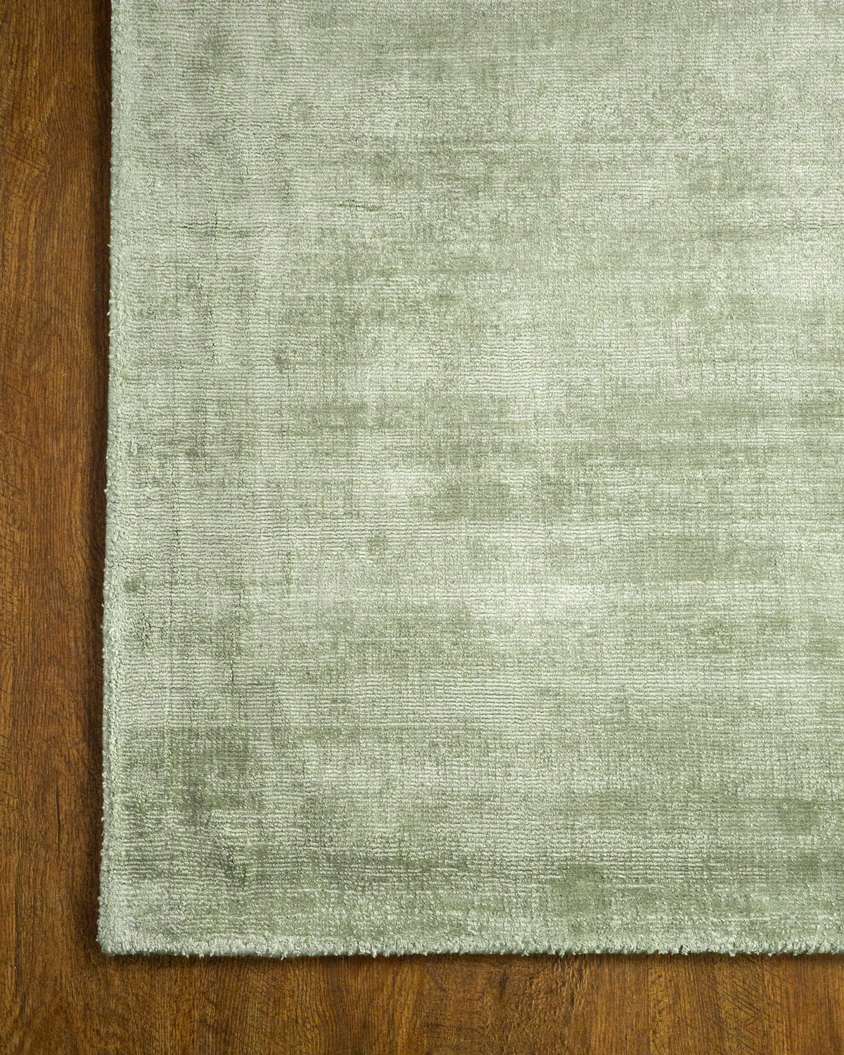 Amara viscose hand-loomed area rug in Sage, corner detail