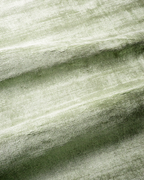 Amara viscose hand-loomed area rug in Sage, draped to show the sheen