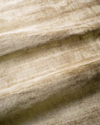 Amara viscose hand-loomed area rug in Shell Beige, draped to show the sheen