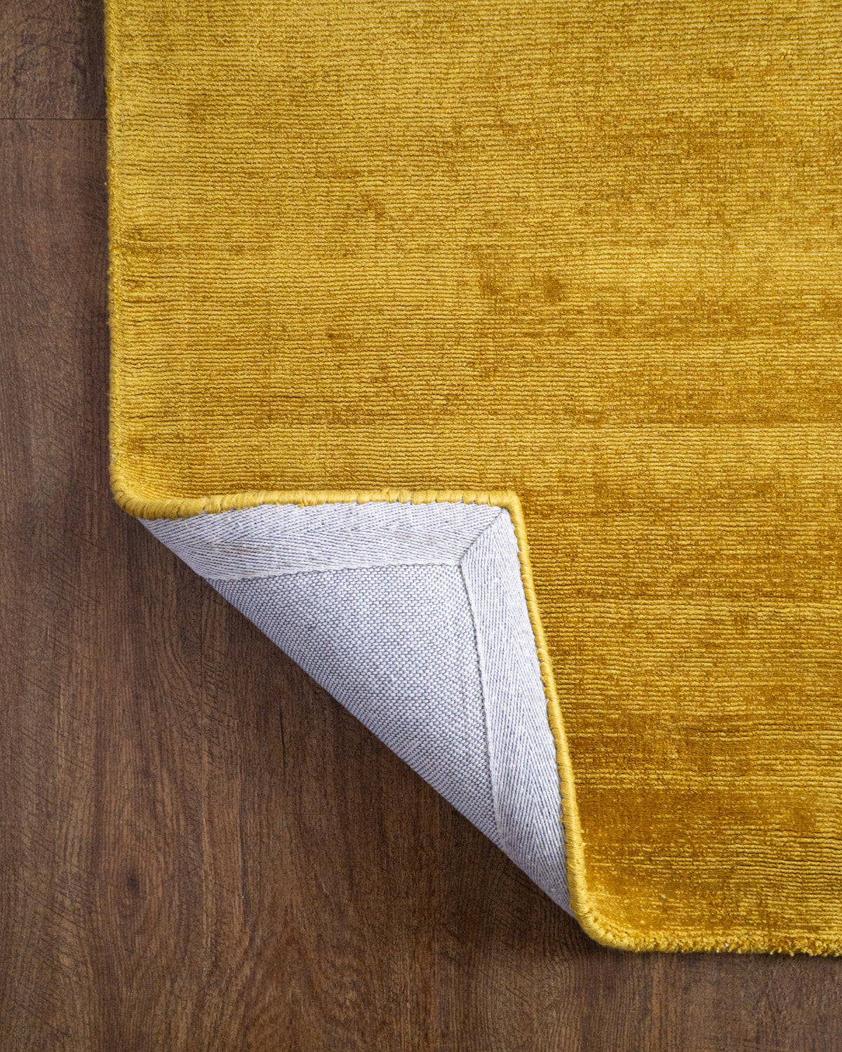 Amara viscose hand-loomed area rug in Yellow, backing view