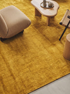 Amara viscose hand-loomed area rug in Yellow, lifestyle close-up