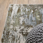 Abstract distressed rug with blue, grey and white textured pattern