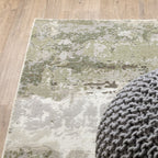 Distressed vintage rug with muted green, beige and grey abstract texture pattern