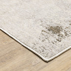 Distressed beige and grey textured rug with mottled vintage appearance