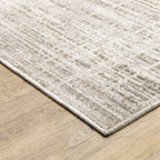 Beige textured area rug with abstract grid pattern on light wood flooring