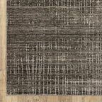 Gray textured area rug with white linear crosshatch pattern throughout