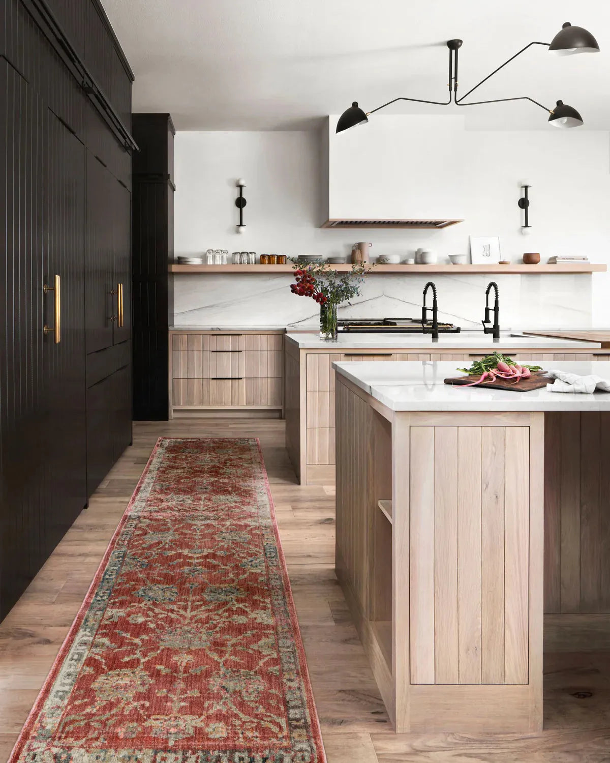 Red and cream vintage patterned runner rug in modern kitchen with wood cabinetry