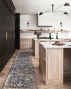 Dark blue traditional rug with ornate floral damask pattern in cream and rose tones