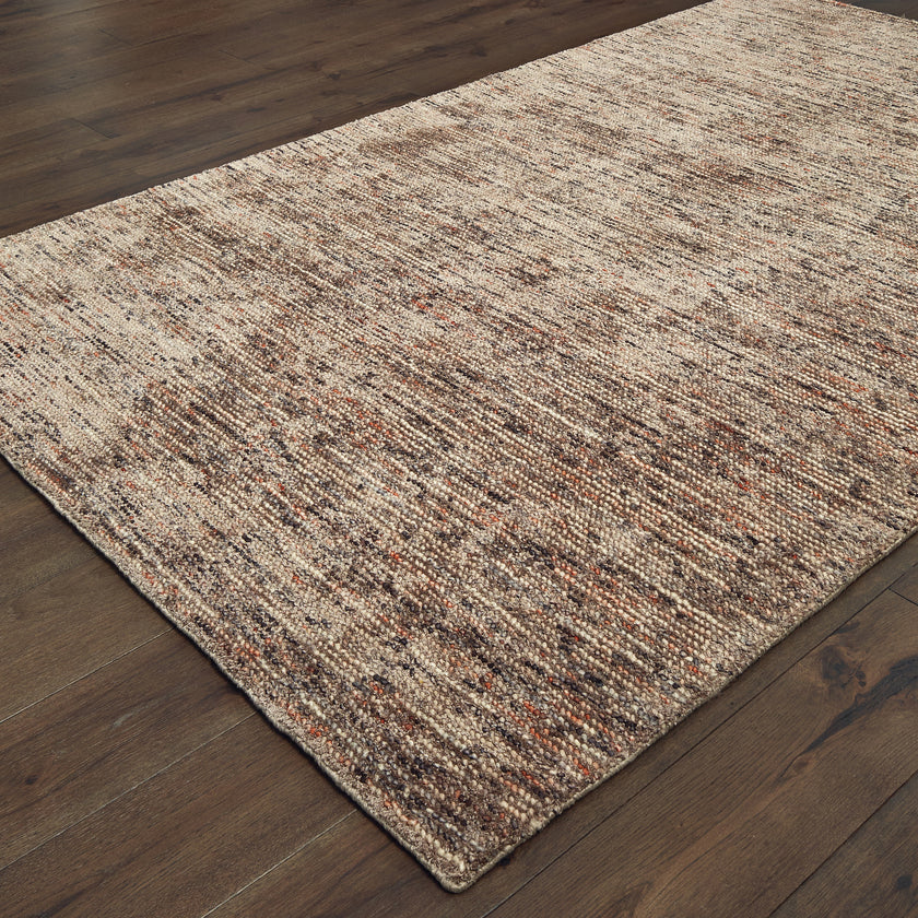 Brown and beige textured area rug with woven natural fiber appearance