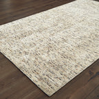 Beige and brown textured wool rug with natural speckled pattern