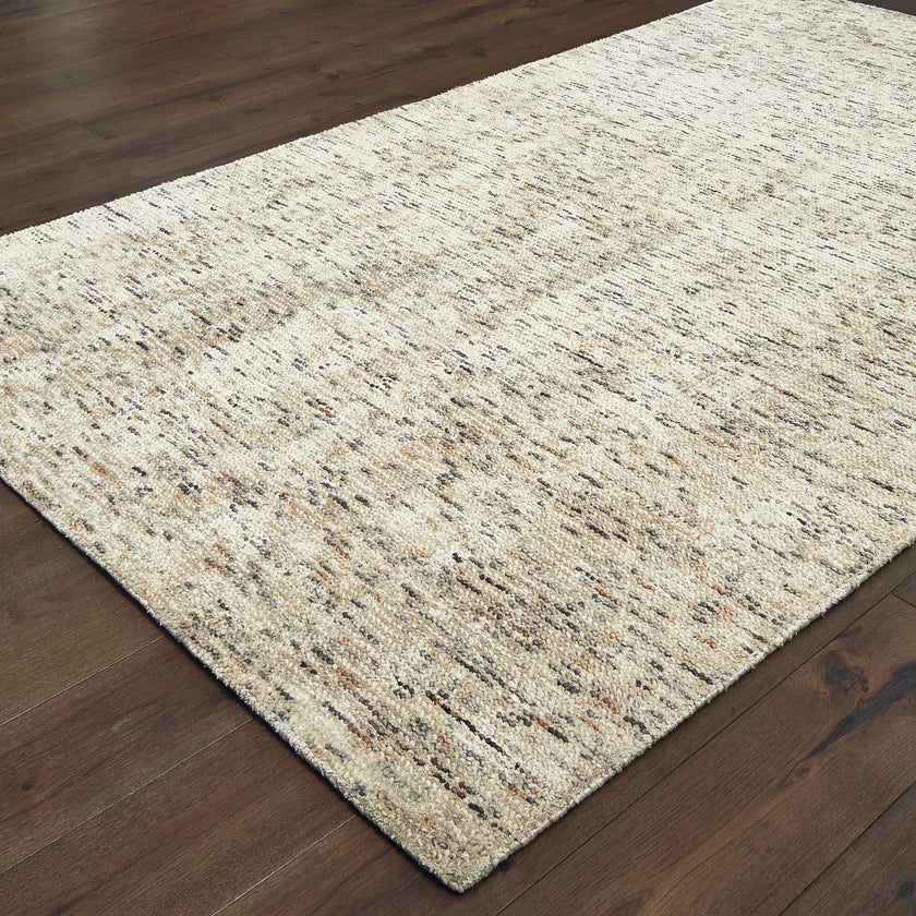 Beige and brown textured wool rug with natural speckled pattern
