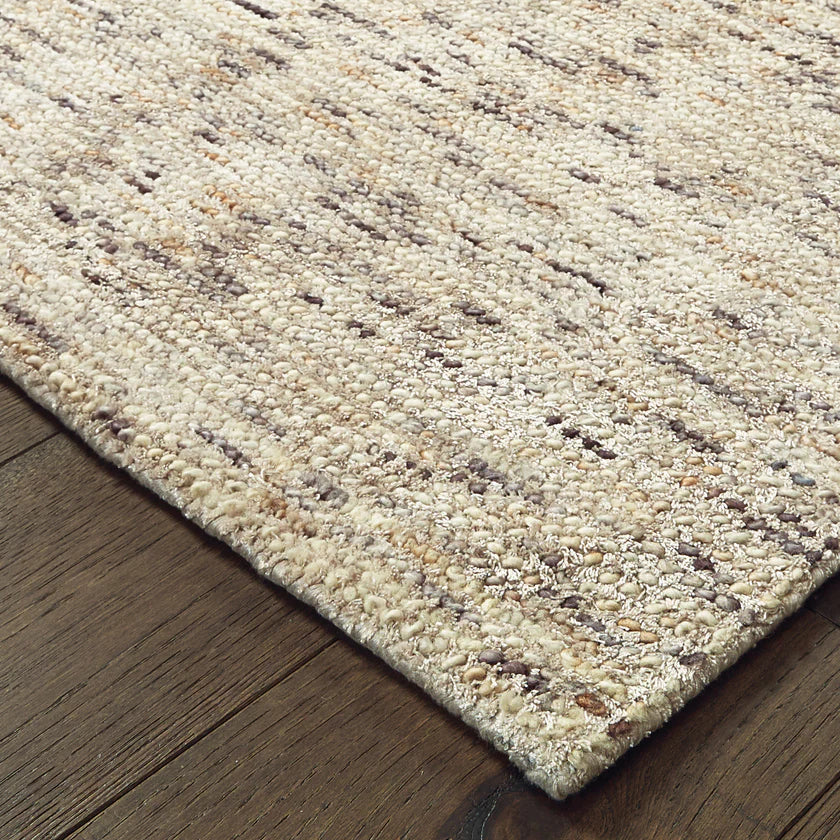 Beige and brown textured wool rug with natural speckled pattern