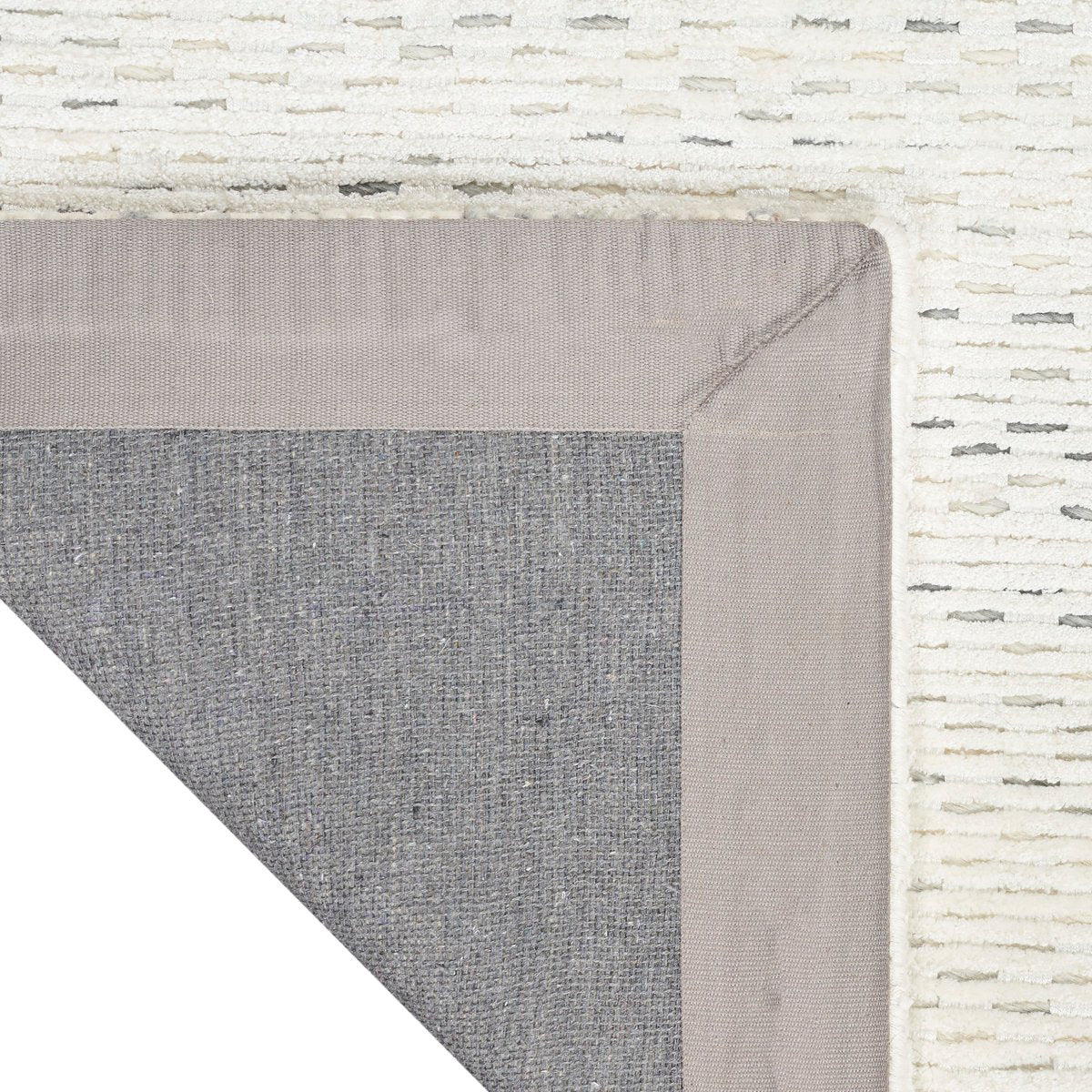 Cream textured area rug with subtle horizontal striping and natural woven pattern