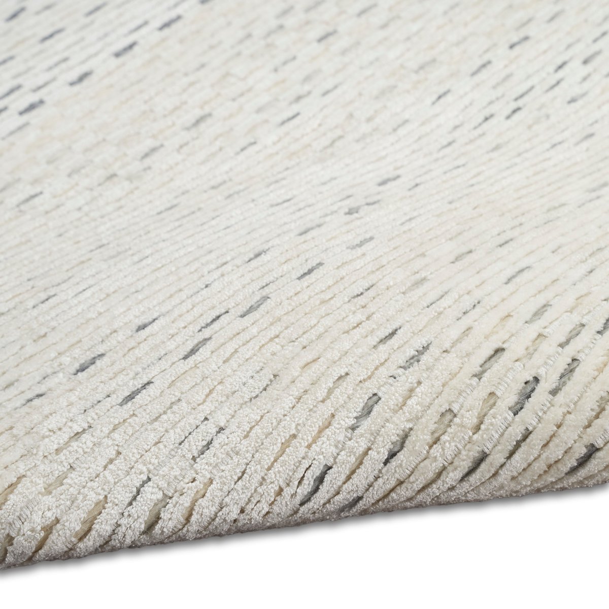Cream textured area rug with subtle horizontal striping and natural woven pattern