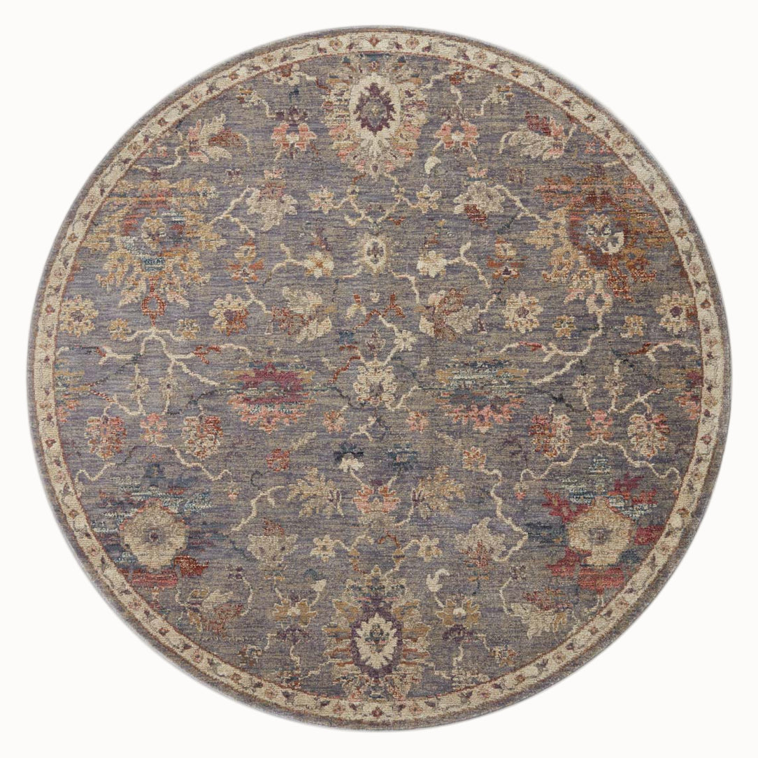 Gray traditional rug with floral pattern and ornate border in rust and gold tones