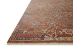 Vintage-style area rug with rust red background and ornate floral damask pattern in cream and blue tones